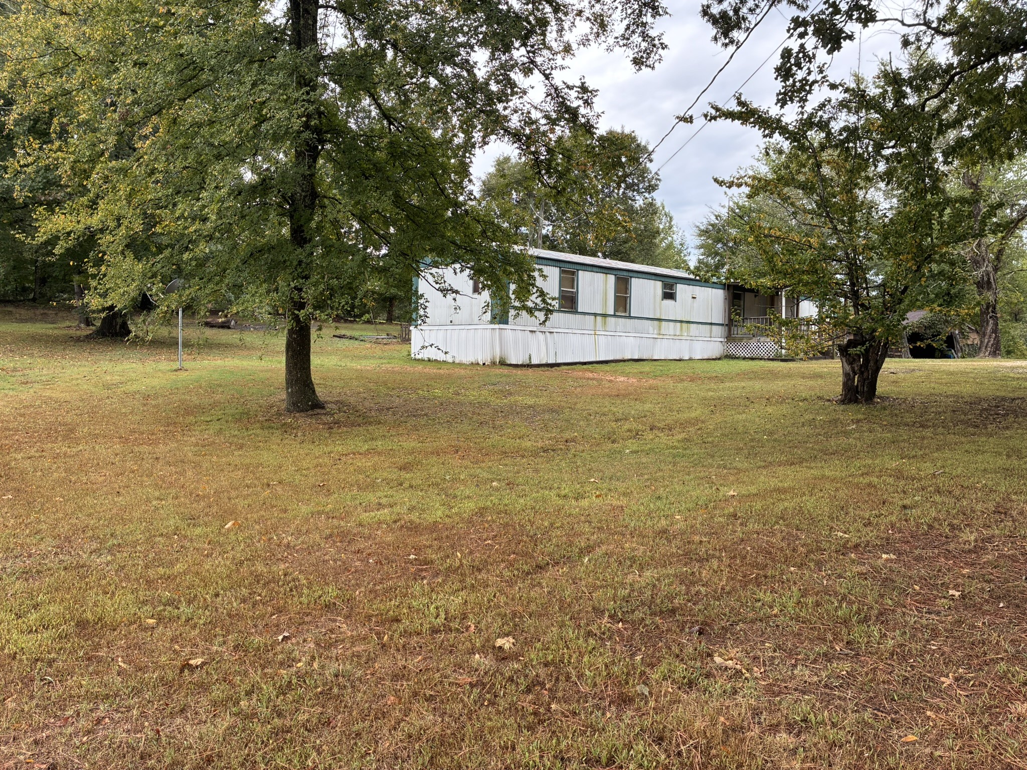 2765 Birdsong Road Camden, TN 38320 - Photo 17 of 18 a front view of a house with a yard