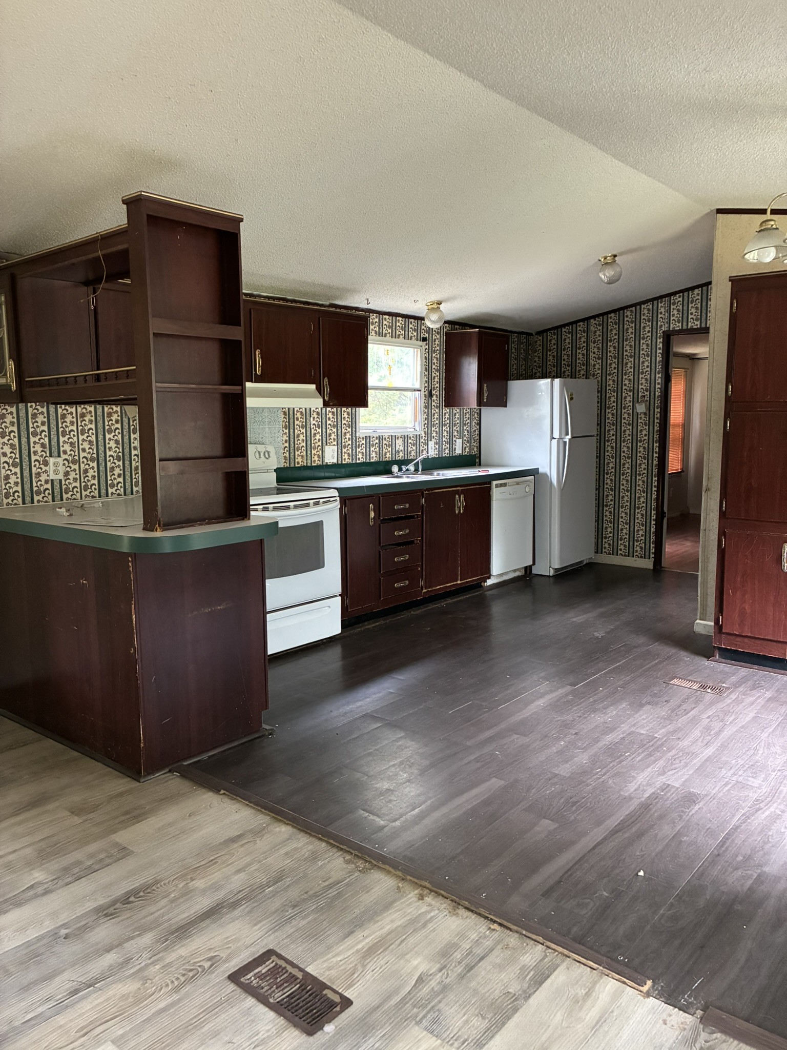 2765 Birdsong Road Camden, TN 38320 - Photo 18 of 18 a kitchen with stainless steel appliances granite countertop a refrigerator and a stove top oven