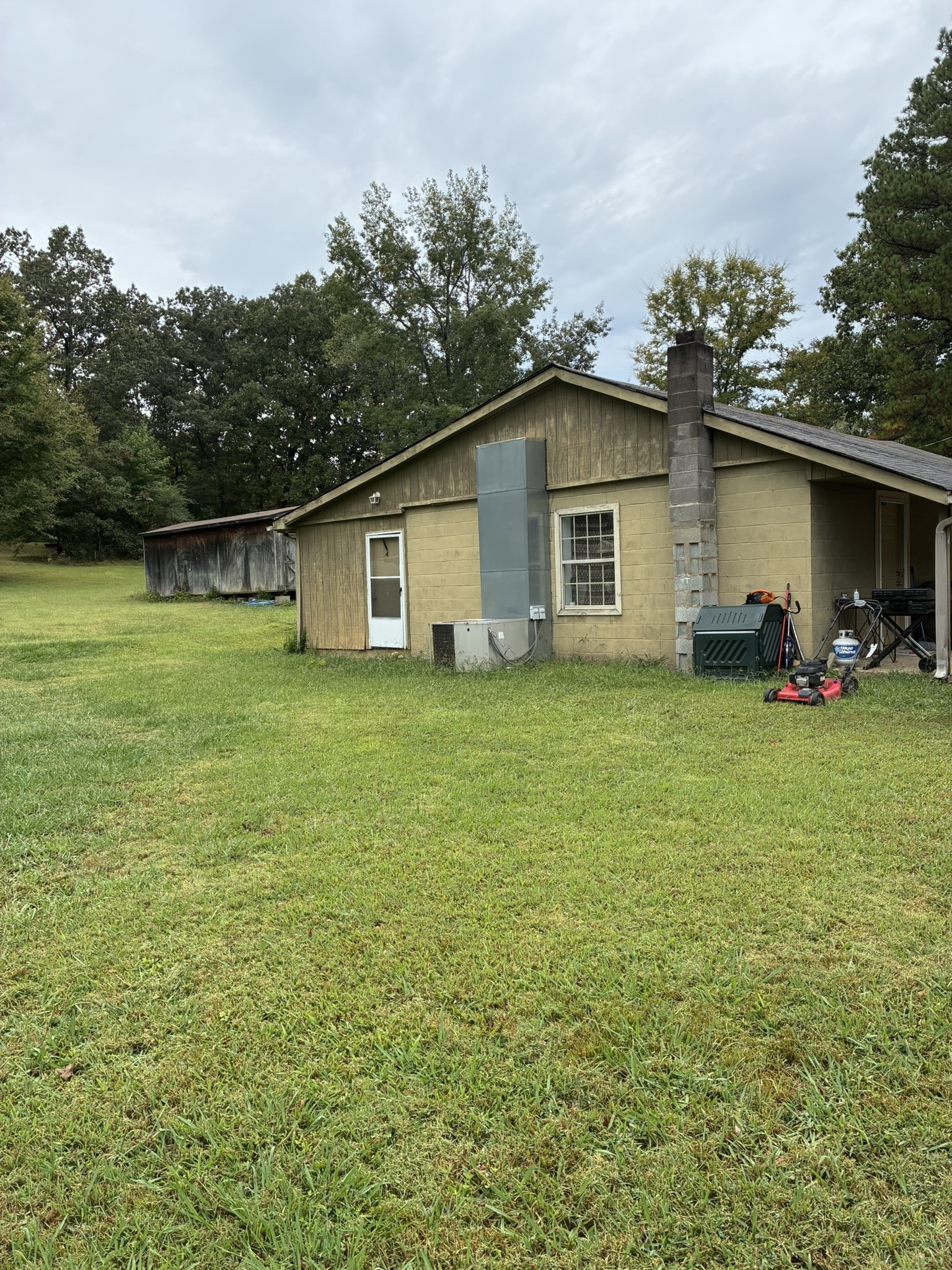 2765 Birdsong Road Camden, TN 38320 - Photo 4 of 18 a house view with a garden space