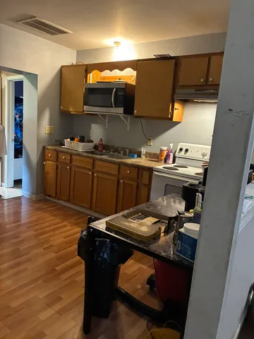 a kitchen with a sink and cabinets