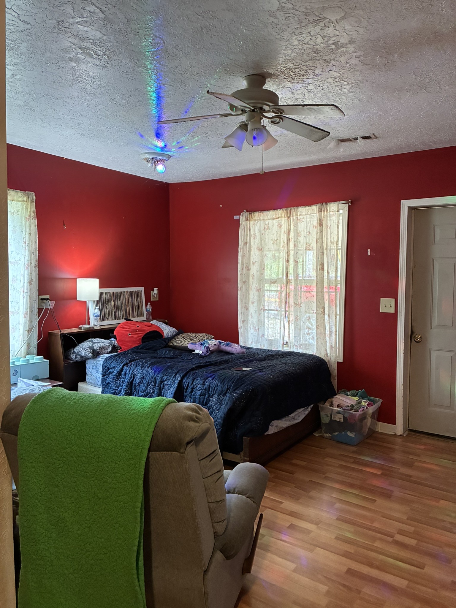 2765 Birdsong Road Camden, TN 38320 - Photo 9 of 18 a bedroom with furniture and a chandelier