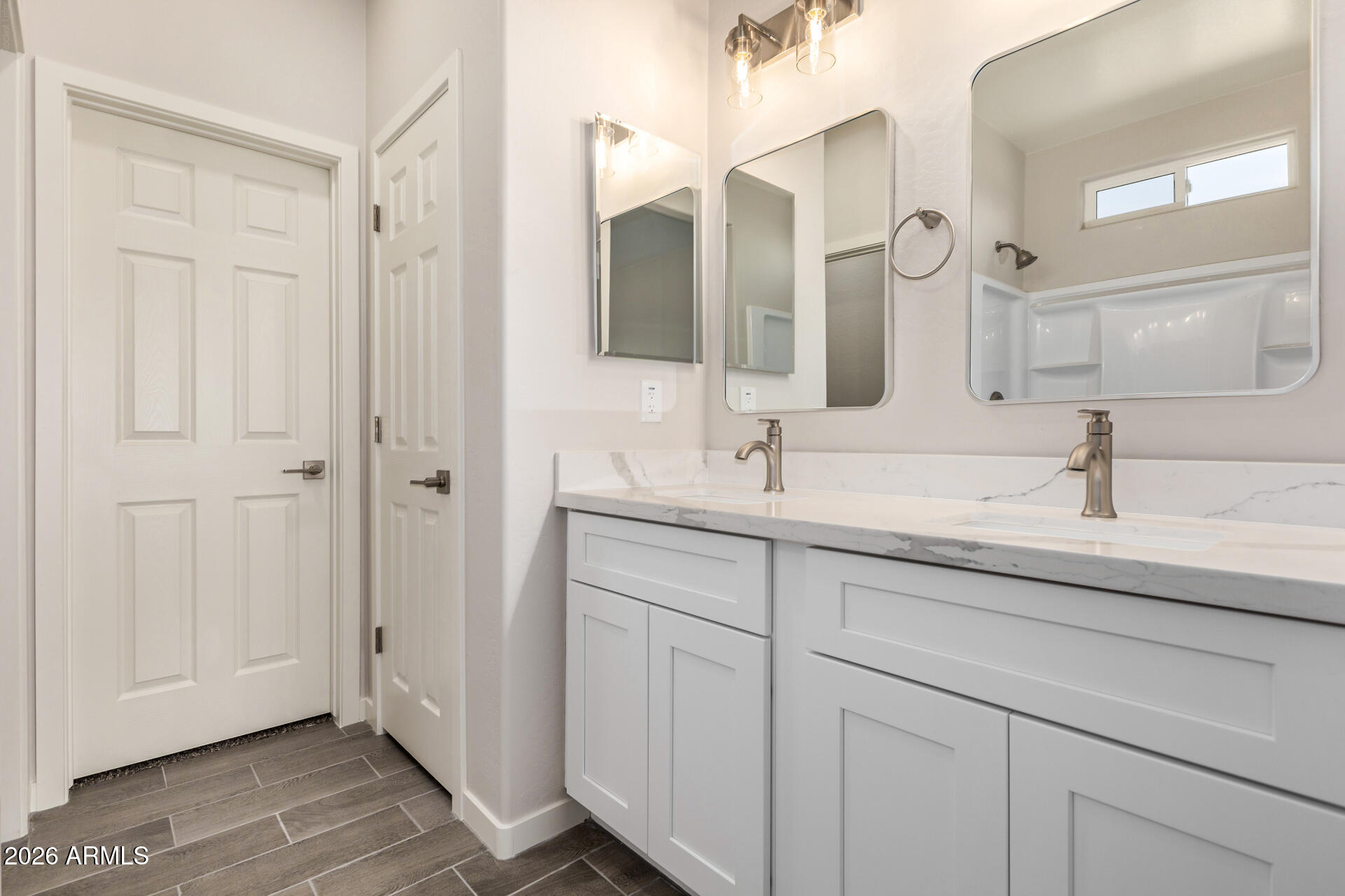 16022 South Naviska Road Arizona City, AZ 85123 - Photo 12 of 25 a bathroom with a double vanity sink and mirror