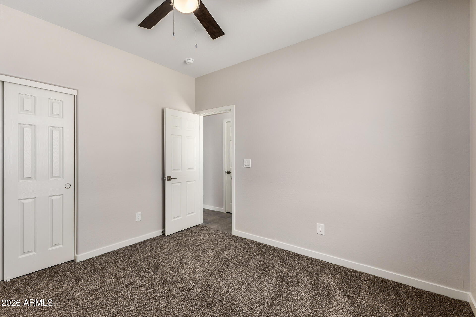 16022 South Naviska Road Arizona City, AZ 85123 - Photo 16 of 25 an empty room with chandelier fan