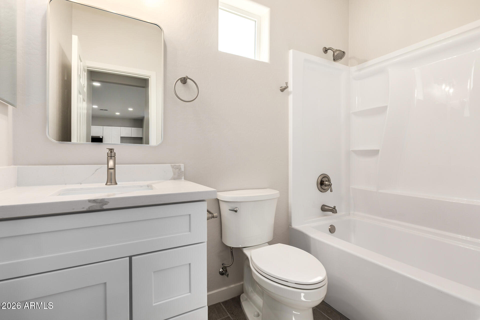 16022 South Naviska Road Arizona City, AZ 85123 - Photo 19 of 25 a bathroom with a granite countertop toilet a sink and a bathtub