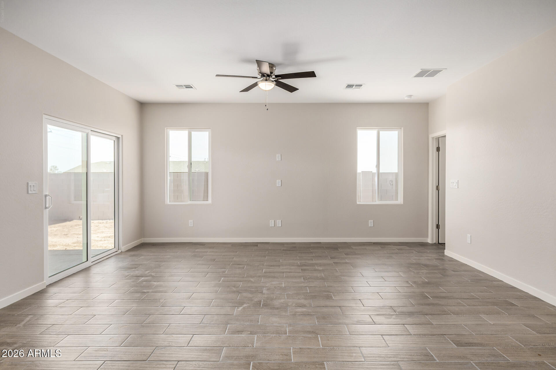 16022 South Naviska Road Arizona City, AZ 85123 - Photo 6 of 25 a view of an empty room with a window