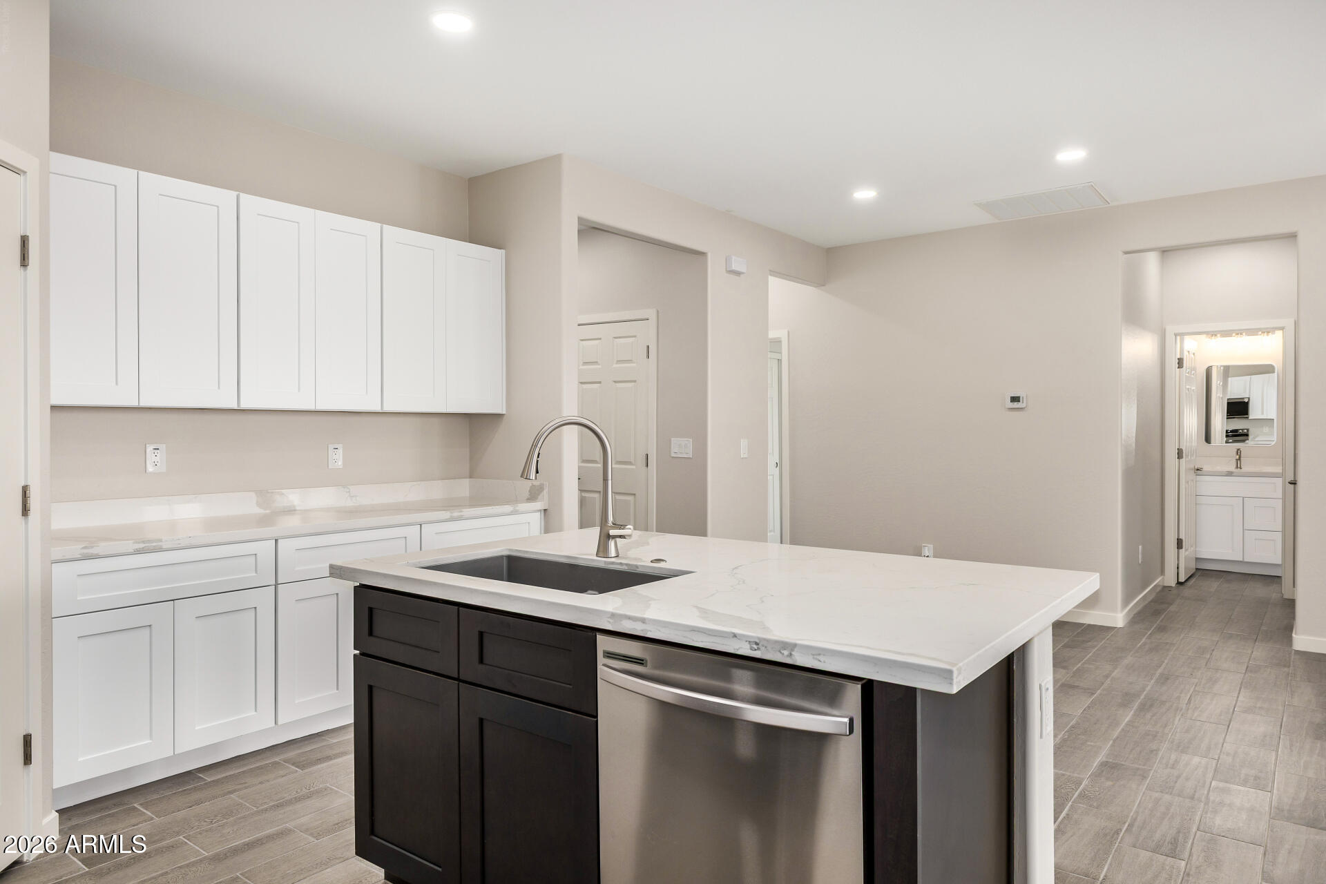 16022 South Naviska Road Arizona City, AZ 85123 - Photo 8 of 25 a kitchen with a sink dishwasher and cabinets