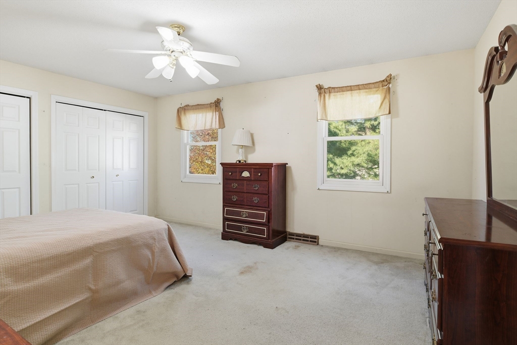 200 Lambert Terrace, Unit 70 Chicopee, MA 01020 - Photo 19 of 39 a bedroom with a bed dresser and a window