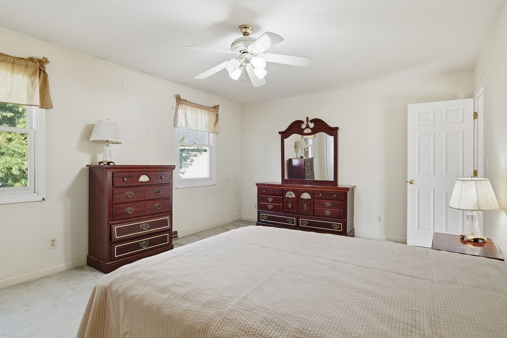 200 Lambert Terrace, Unit 70 Chicopee, MA 01020 - Photo 23 of 39 a bedroom with a bed and a dresser