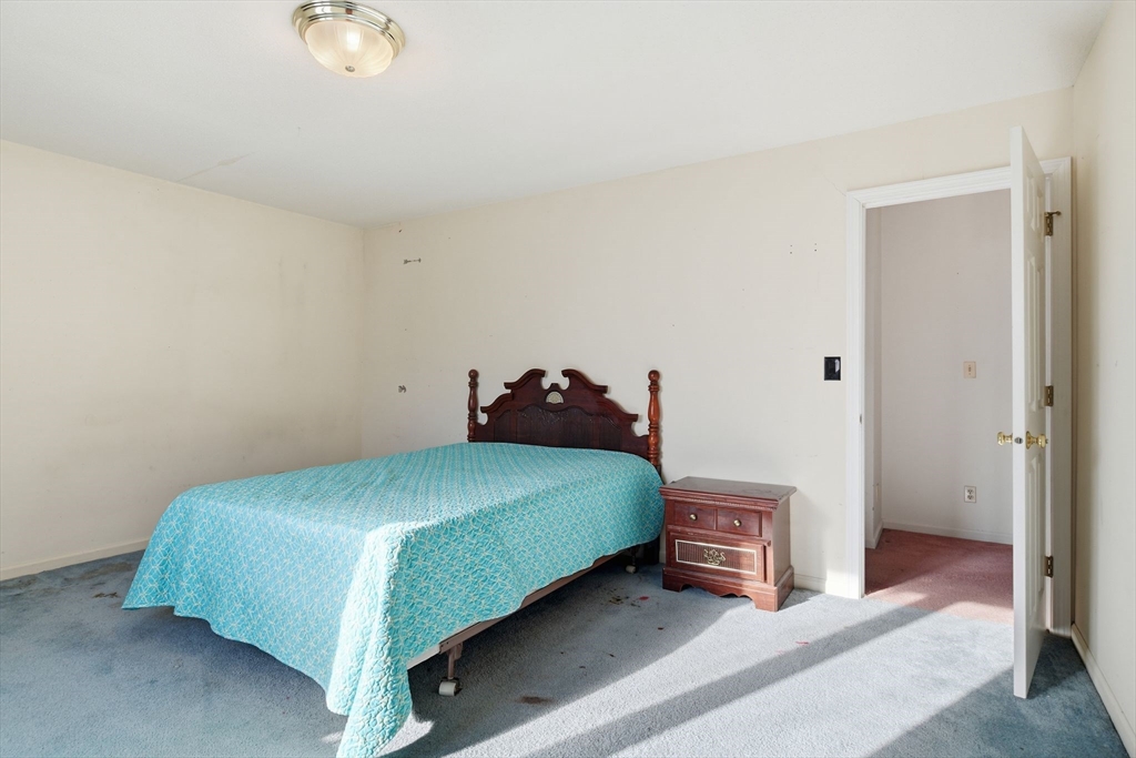 200 Lambert Terrace, Unit 70 Chicopee, MA 01020 - Photo 27 of 39 a bedroom with a bed and a cabinets