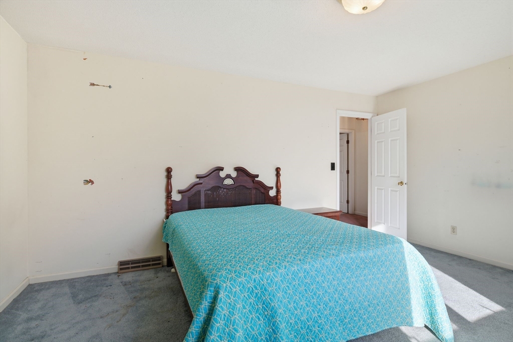 200 Lambert Terrace, Unit 70 Chicopee, MA 01020 - Photo 28 of 39 a bedroom with a bed and a closet