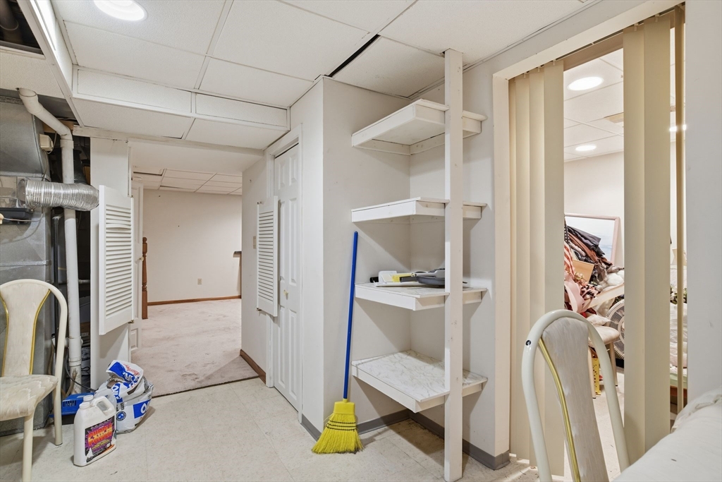 200 Lambert Terrace, Unit 70 Chicopee, MA 01020 - Photo 34 of 39 a view of walk in closet with clothes and shoes