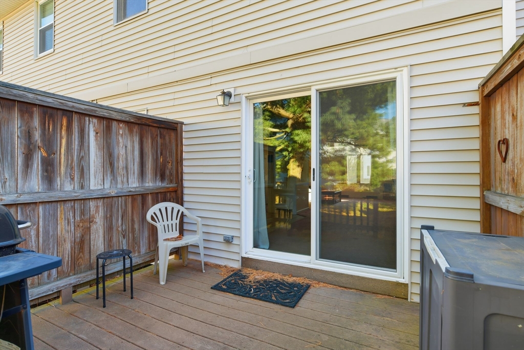 200 Lambert Terrace, Unit 70 Chicopee, MA 01020 - Photo 36 of 39 a view of a deck with wooden floor and outdoor seating