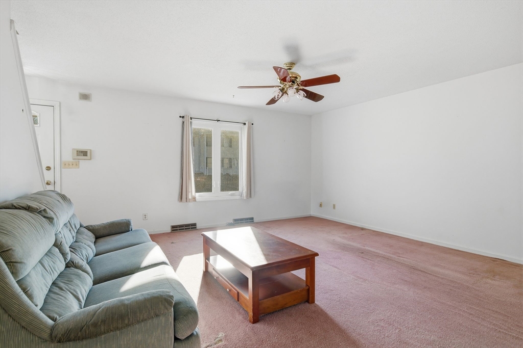 200 Lambert Terrace, Unit 70 Chicopee, MA 01020 - Photo 8 of 39 a living room with furniture