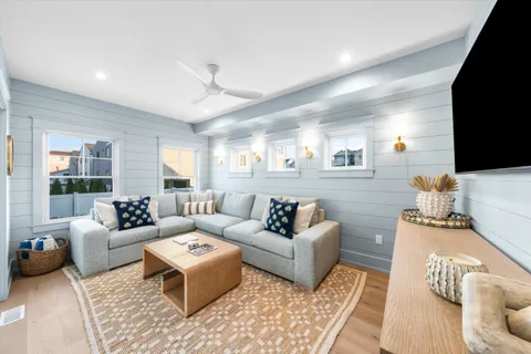 a living room with furniture or couch and a flat screen tv