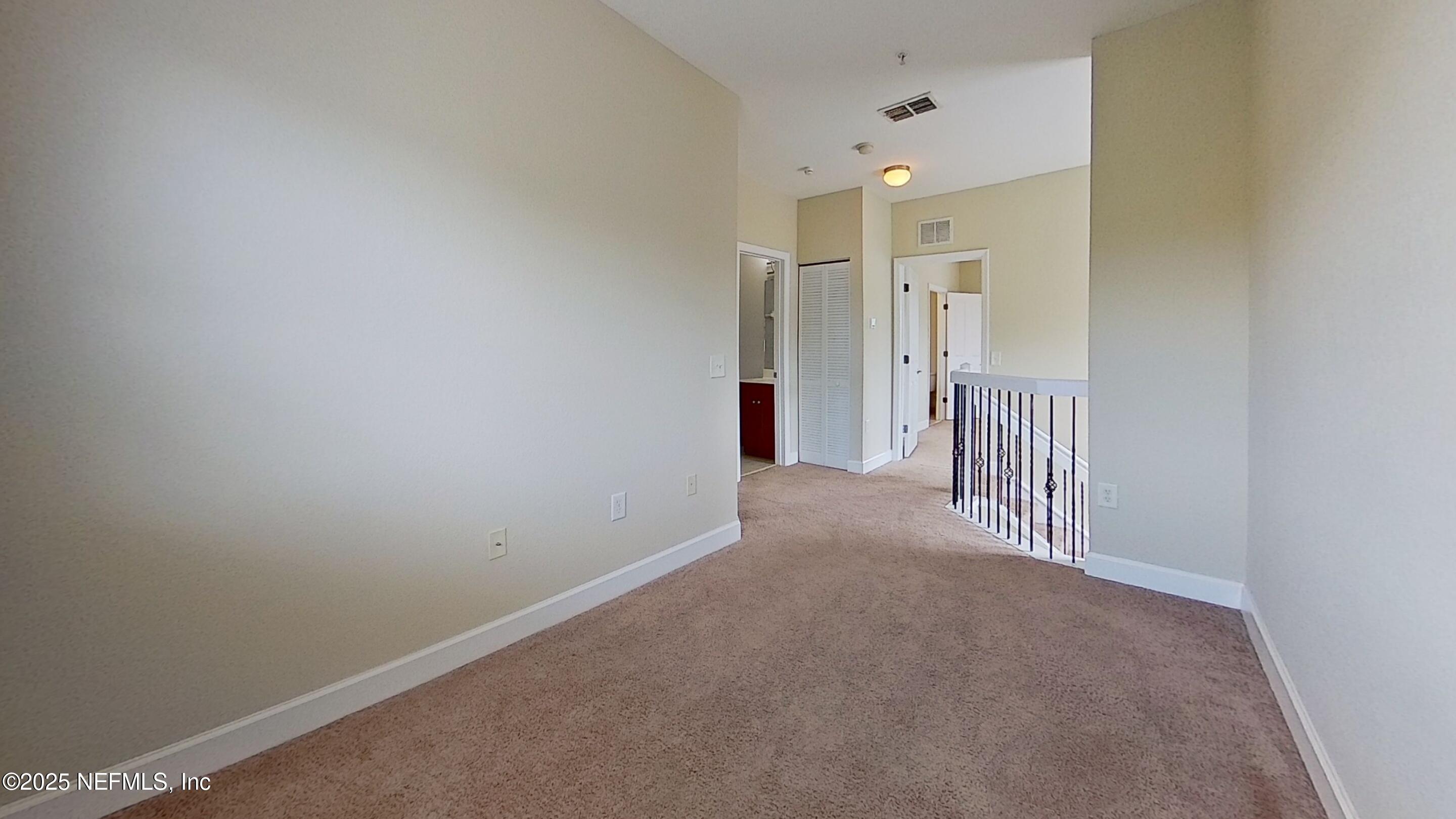 9745 Touchton Road, Unit 1421 Jacksonville, FL 32246 - Photo 13 of 22 a view of a hallway with closet