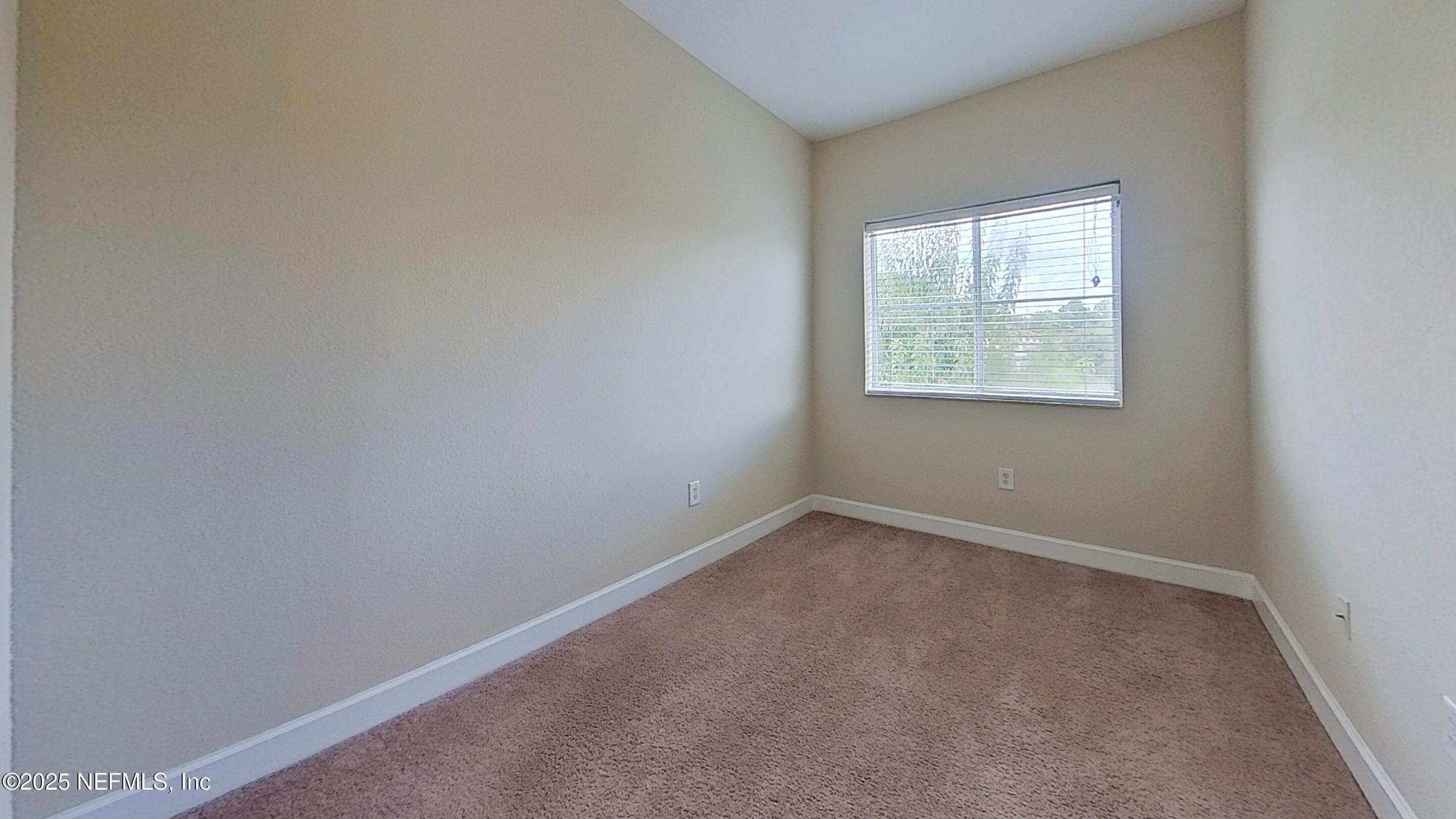 9745 Touchton Road, Unit 1421 Jacksonville, FL 32246 - Photo 14 of 22 an empty room with a window