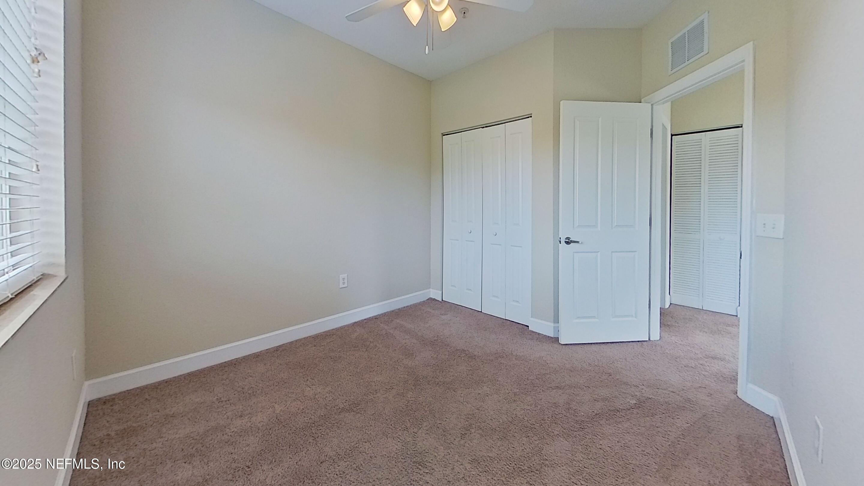9745 Touchton Road, Unit 1421 Jacksonville, FL 32246 - Photo 15 of 22 an empty room with a empty space and a window