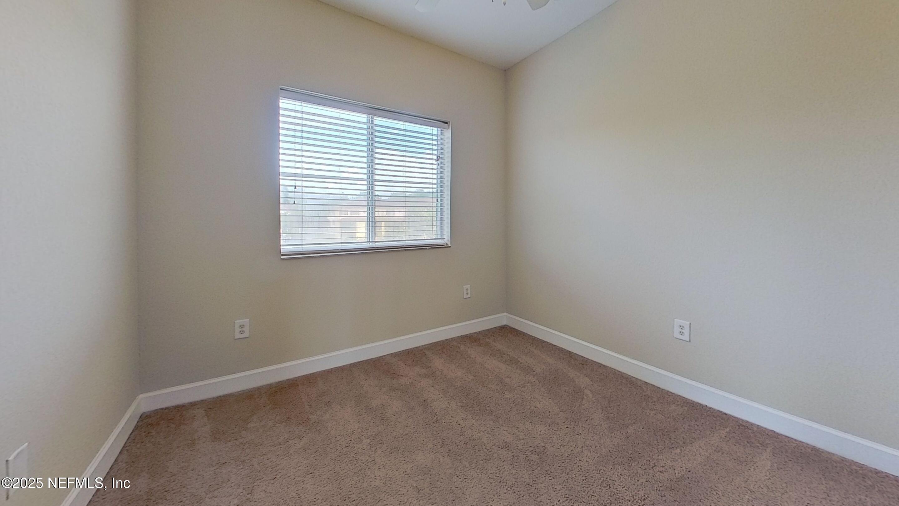 9745 Touchton Road, Unit 1421 Jacksonville, FL 32246 - Photo 16 of 22 an empty room with a window