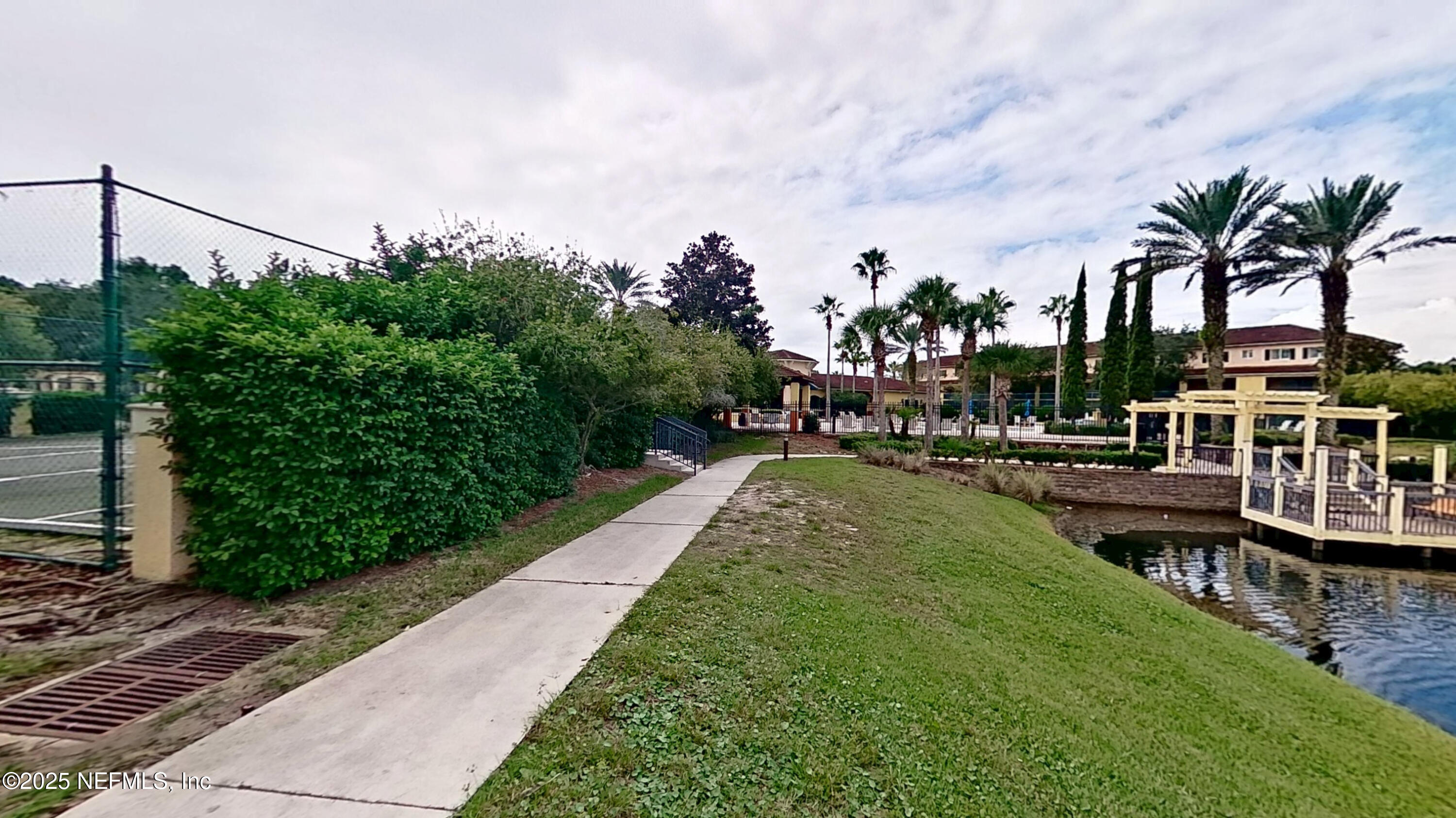 9745 Touchton Road, Unit 1421 Jacksonville, FL 32246 - Photo 18 of 22 a view of a swimming pool with a patio