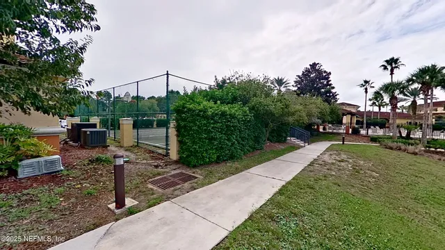 a view of a garden with houses