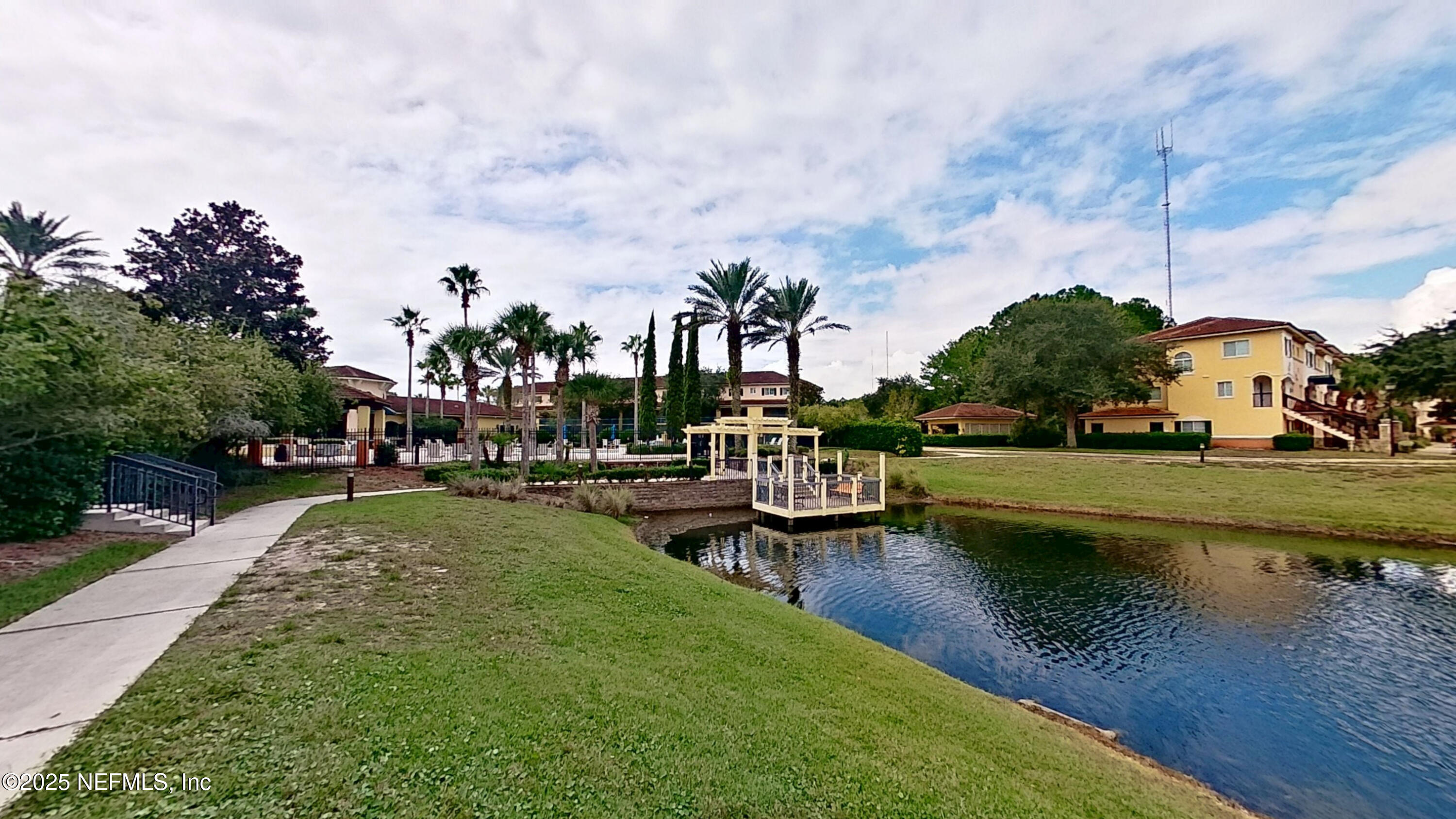 9745 Touchton Road, Unit 1421 Jacksonville, FL 32246 - Photo 20 of 22 a view of a lake with houses