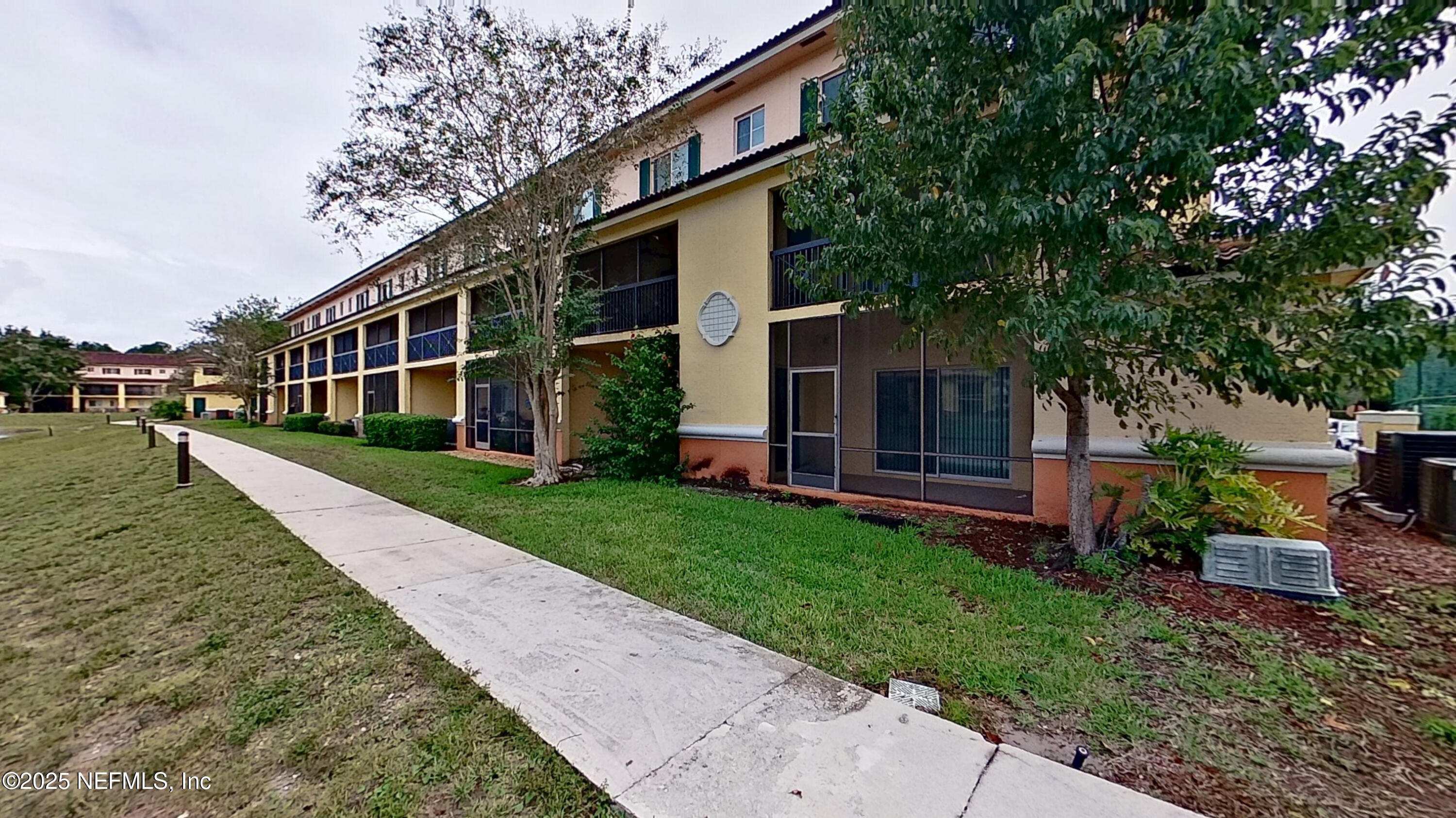 9745 Touchton Road, Unit 1421 Jacksonville, FL 32246 - Photo 22 of 22 a front view of house with yard and green space