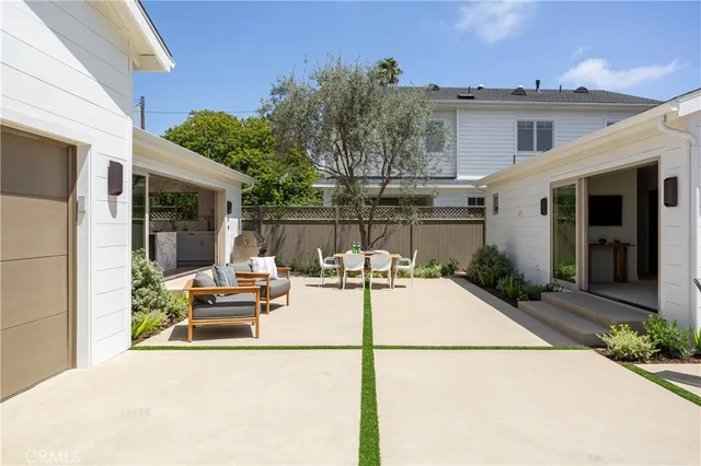 a view of a patio with couches and potted plants