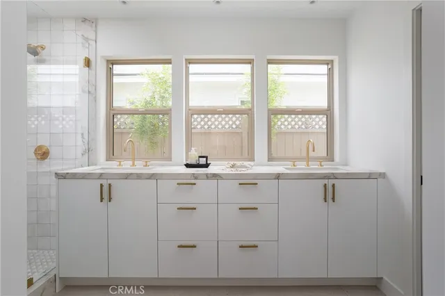 a view of cabinets a sink and a window