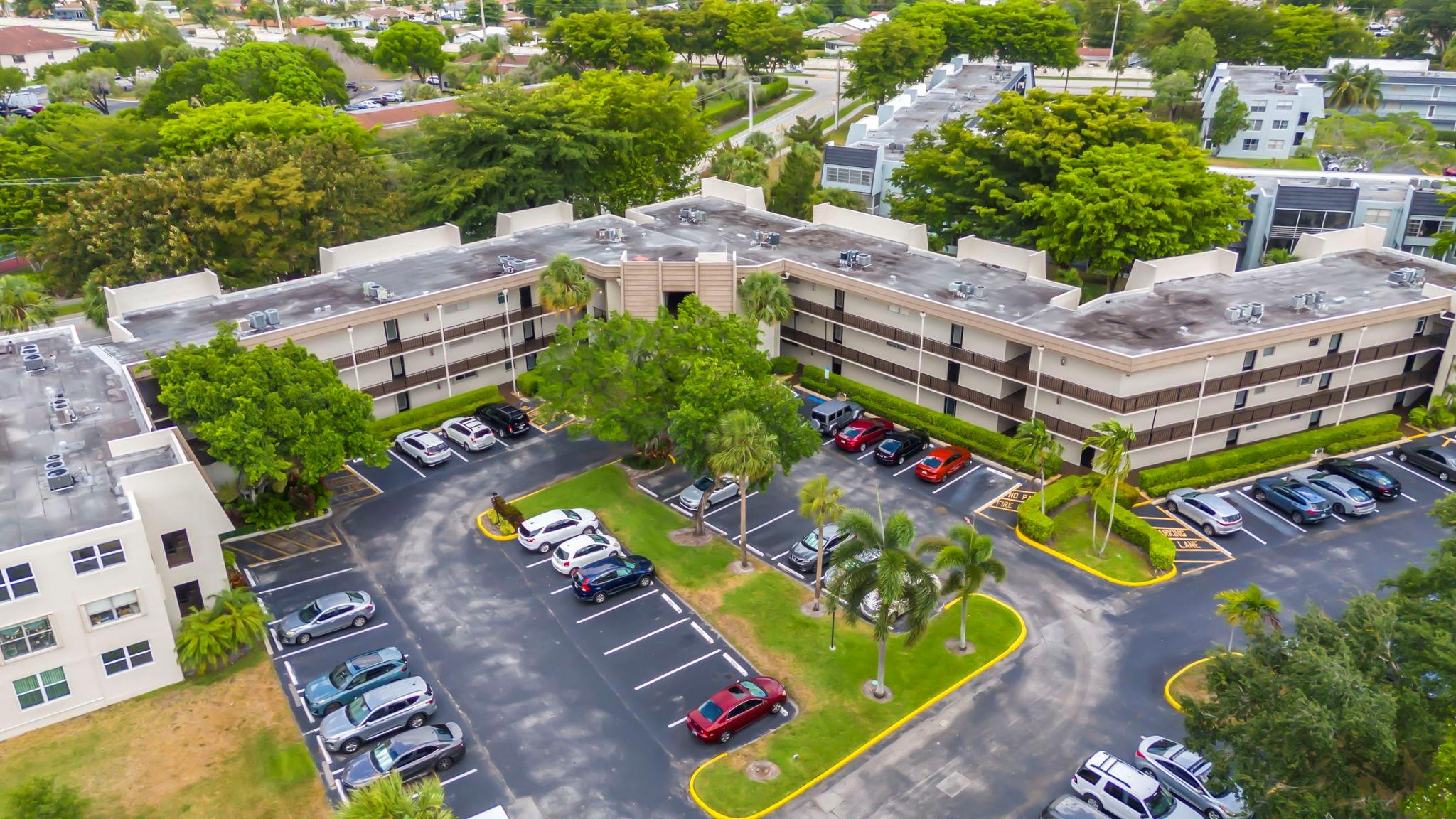 9401 Lime Bay Boulevard, Unit 209 Tamarac, FL 33321 - Photo 17 of 24 aerial view of a swimming pool with outdoor seating