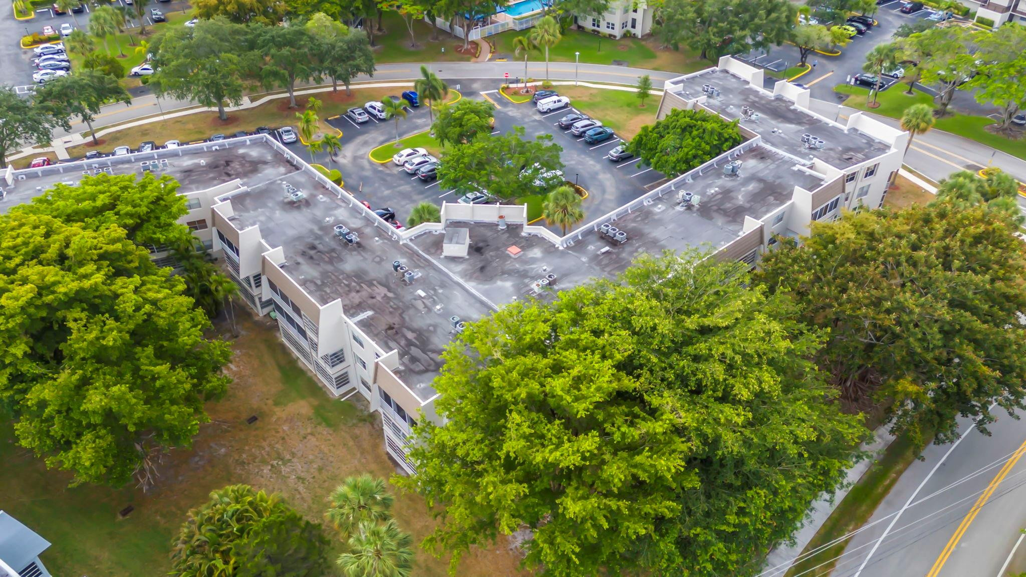 9401 Lime Bay Boulevard, Unit 209 Tamarac, FL 33321 - Photo 21 of 24 an aerial view of a garden