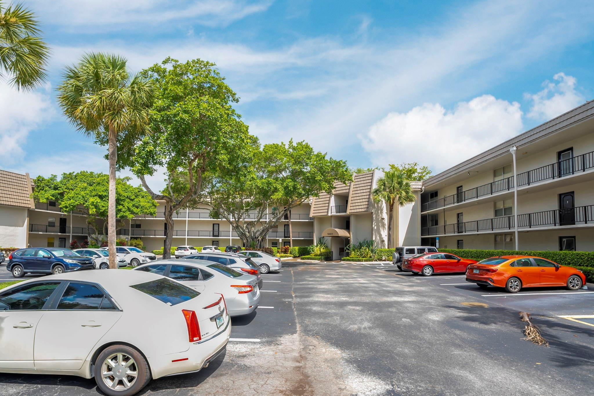 9401 Lime Bay Boulevard, Unit 209 Tamarac, FL 33321 - Photo 23 of 24 a car parked in front of a building