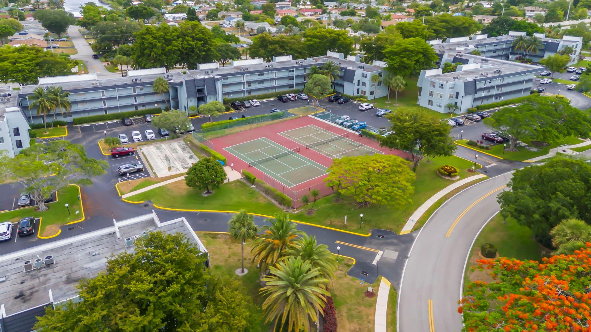 9401 Lime Bay Boulevard, Unit 209 Tamarac, FL 33321 - Photo 24 of 24 an aerial view of a house with a swimming pool patio and outdoor seating