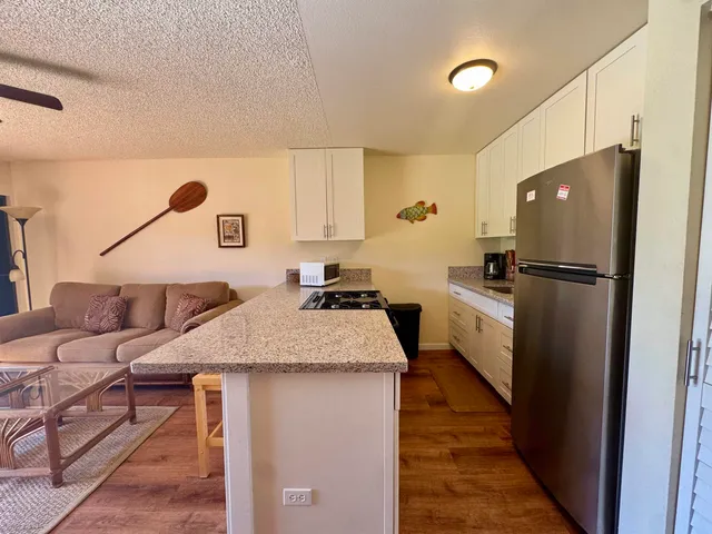 a kitchen with a refrigerator and countertop