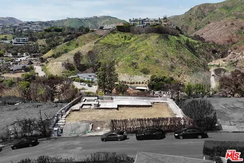 an aerial view of a house with a garden