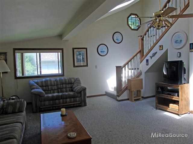 7389 Zenith Road Lexington, MI 48450 - Photo 7 of 11 living room w/ stairs