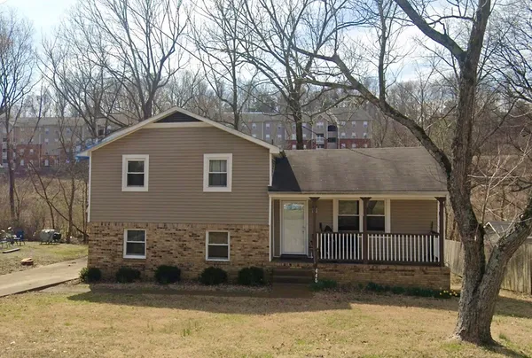 a front view of a house with a yard