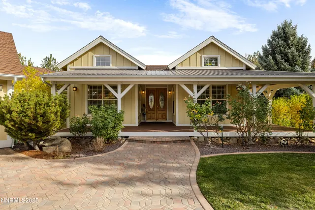 a front view of a house with garden