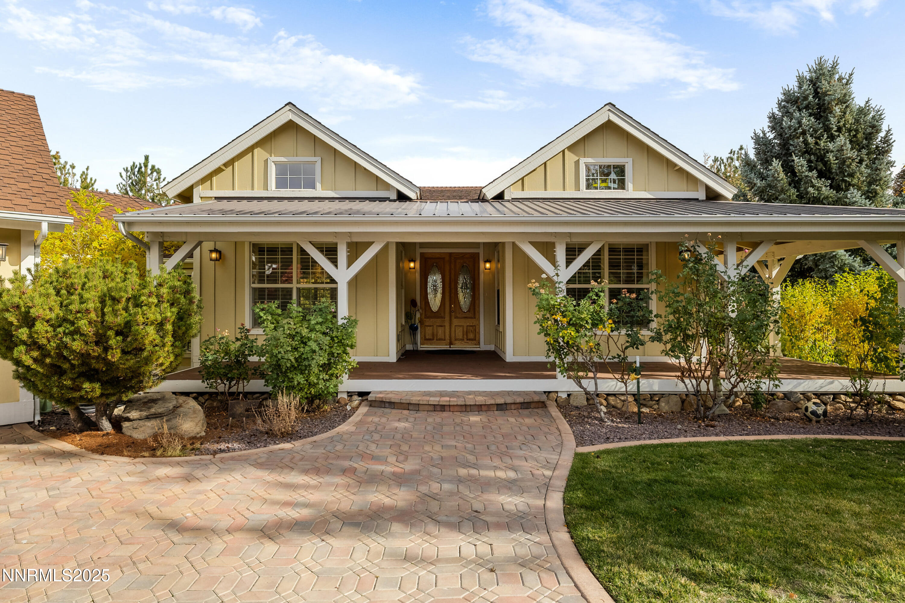 a front view of a house with garden