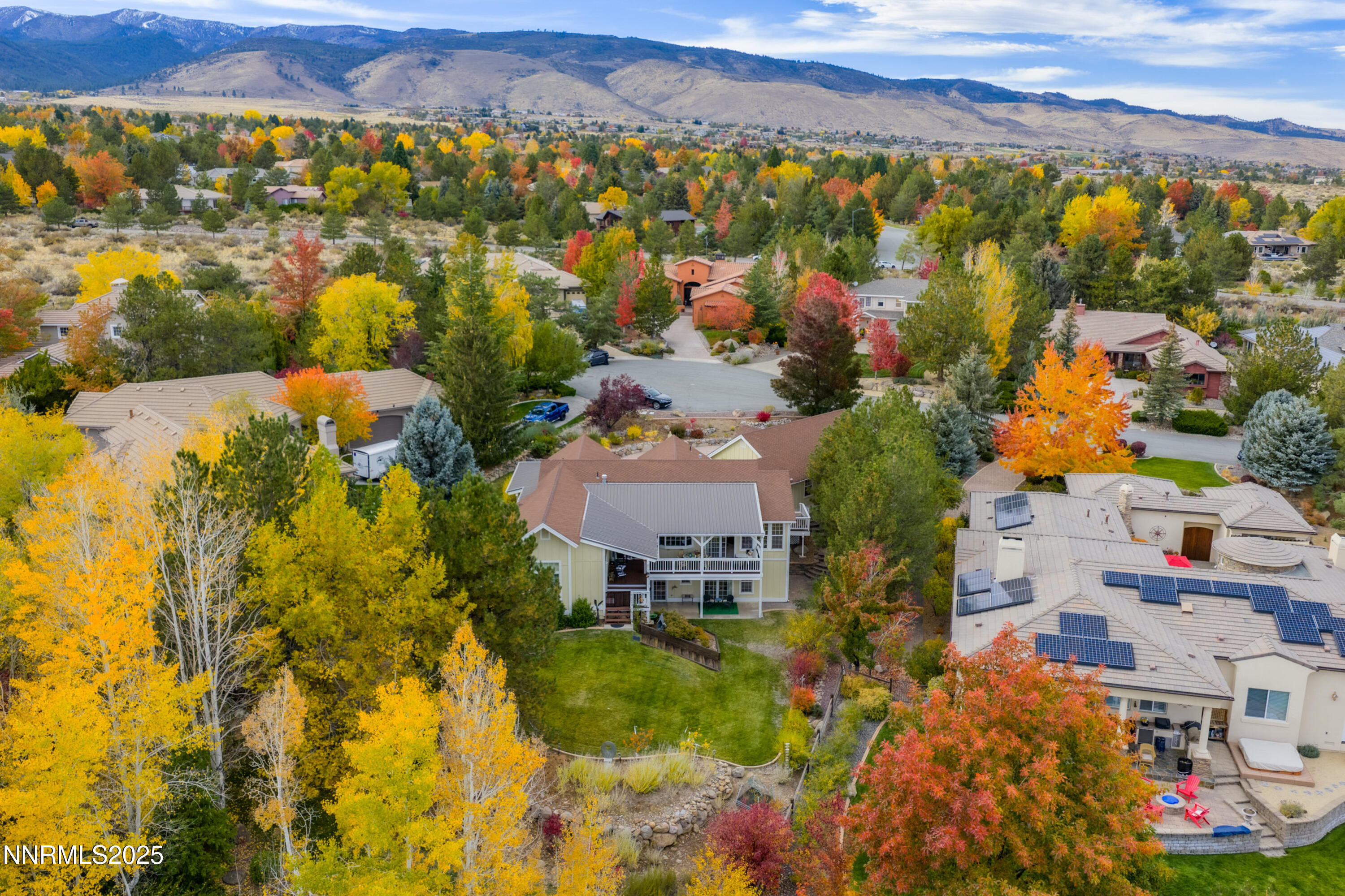 an aerial view of residential houses with outdoor space