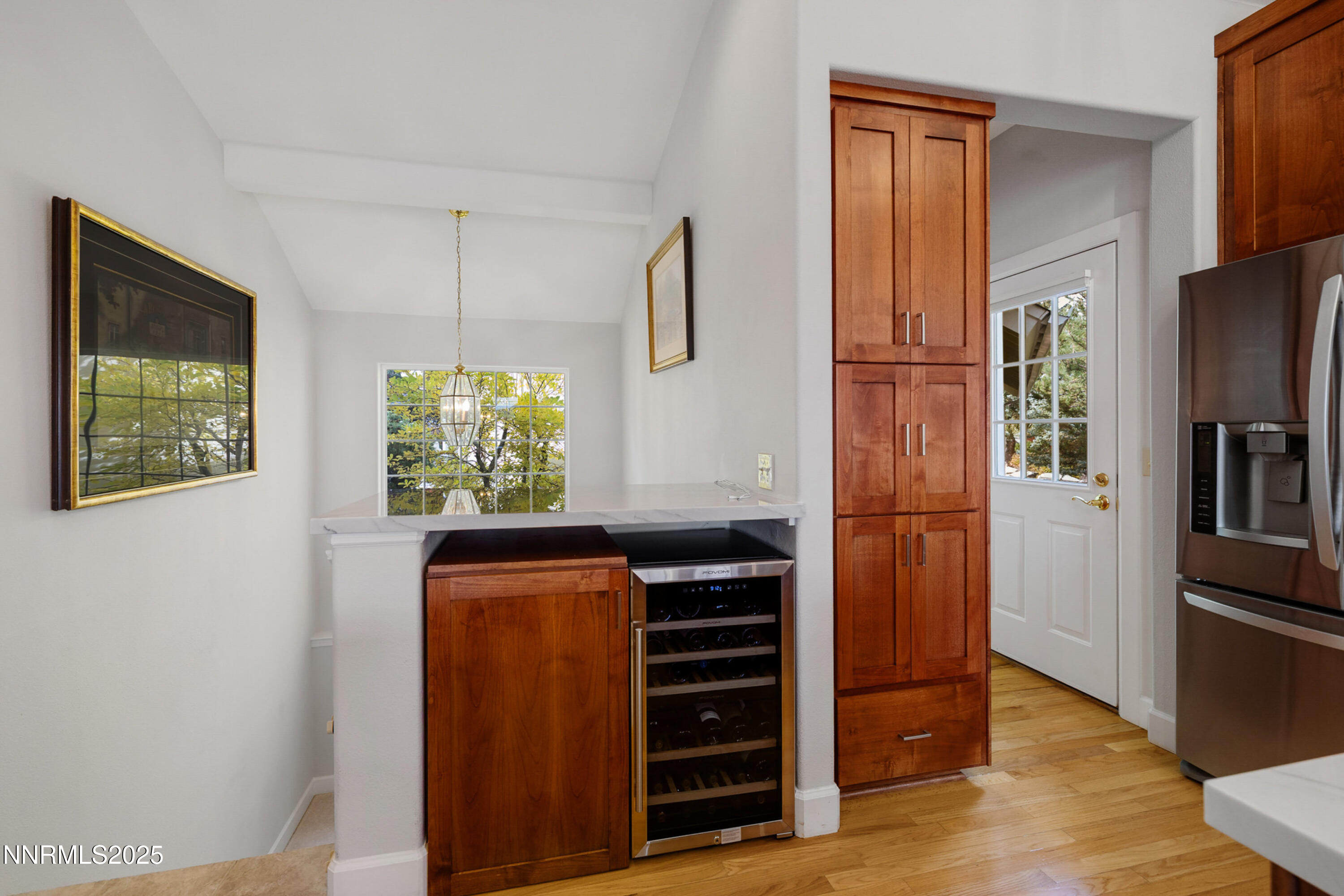 14240 Bandolier Court Reno, NV 89511 - Photo 15 of 47 a kitchen with stainless steel appliances a refrigerator and a window