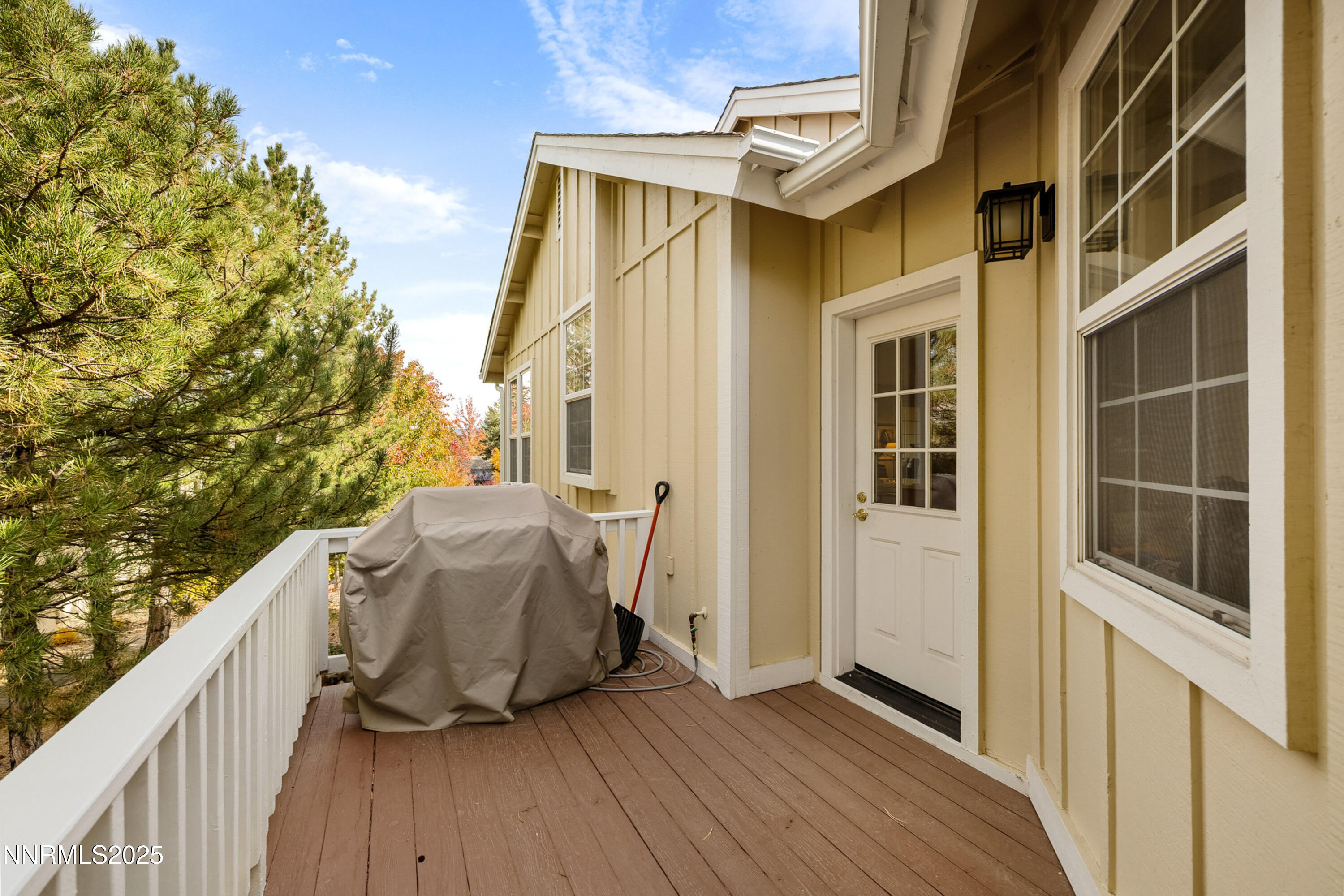 14240 Bandolier Court Reno, NV 89511 - Photo 17 of 47 a view of balcony with furniture and wooden floor