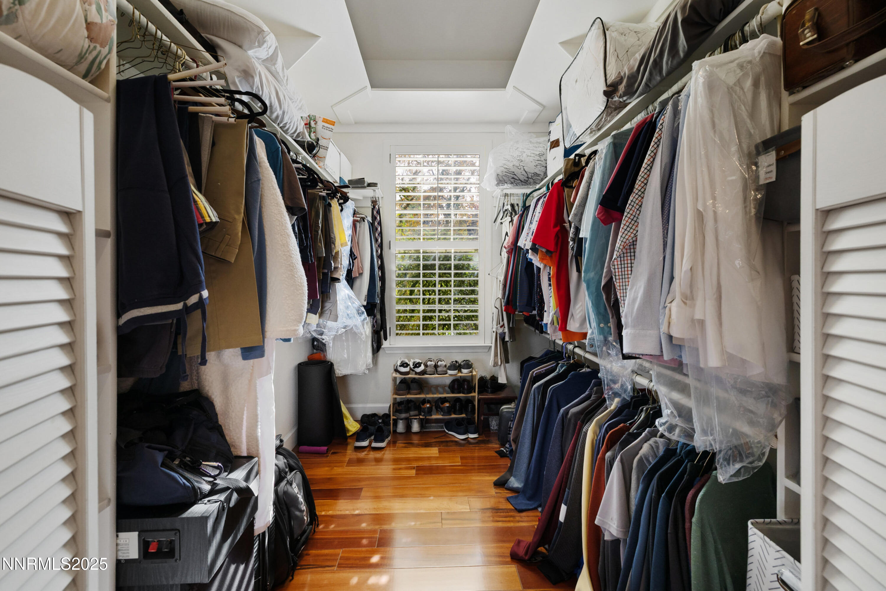 14240 Bandolier Court Reno, NV 89511 - Photo 21 of 47 a view of walk in closet with clothes and shoes
