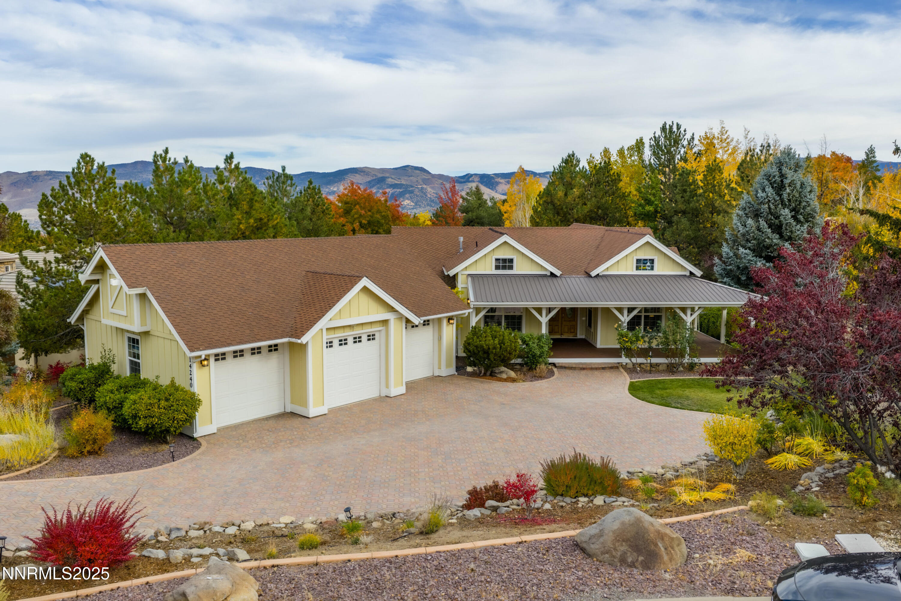 14240 Bandolier Court Reno, NV 89511 - Photo 3 of 47 a view of a house with a big yard plants and large trees