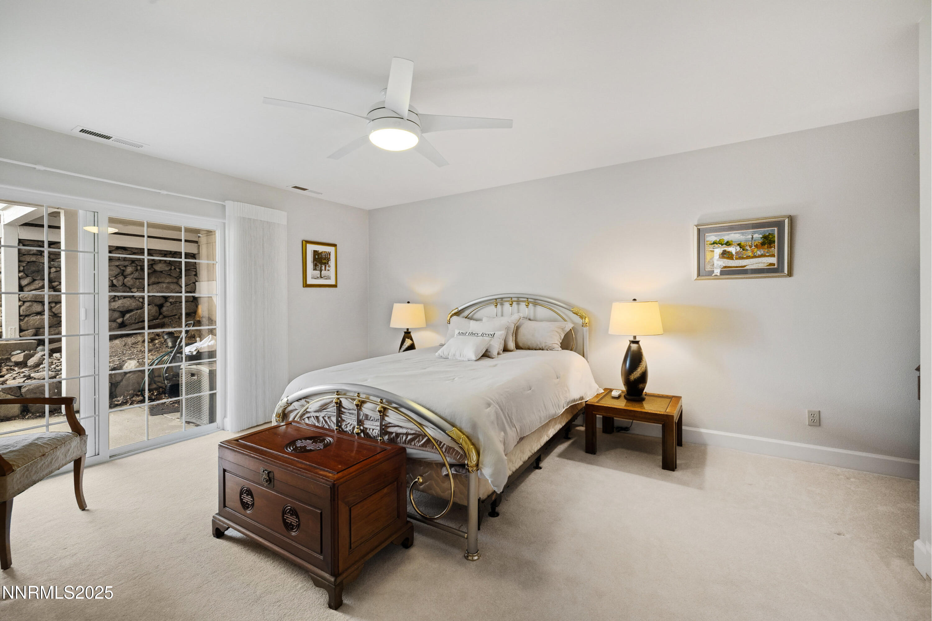 14240 Bandolier Court Reno, NV 89511 - Photo 32 of 47 a bedroom with a bed lamp and a large window