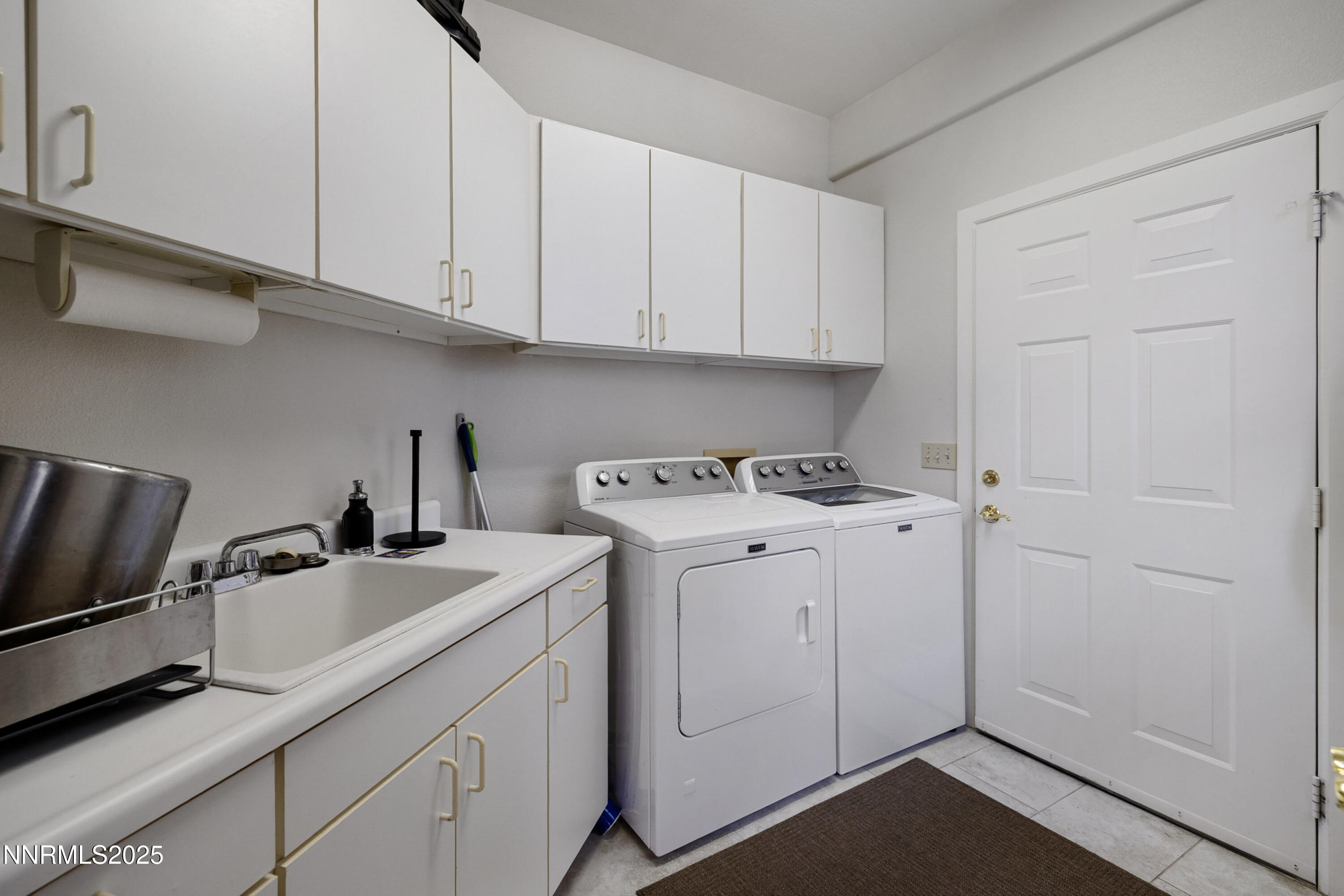 14240 Bandolier Court Reno, NV 89511 - Photo 34 of 47 a utility room with sink dryer and washer