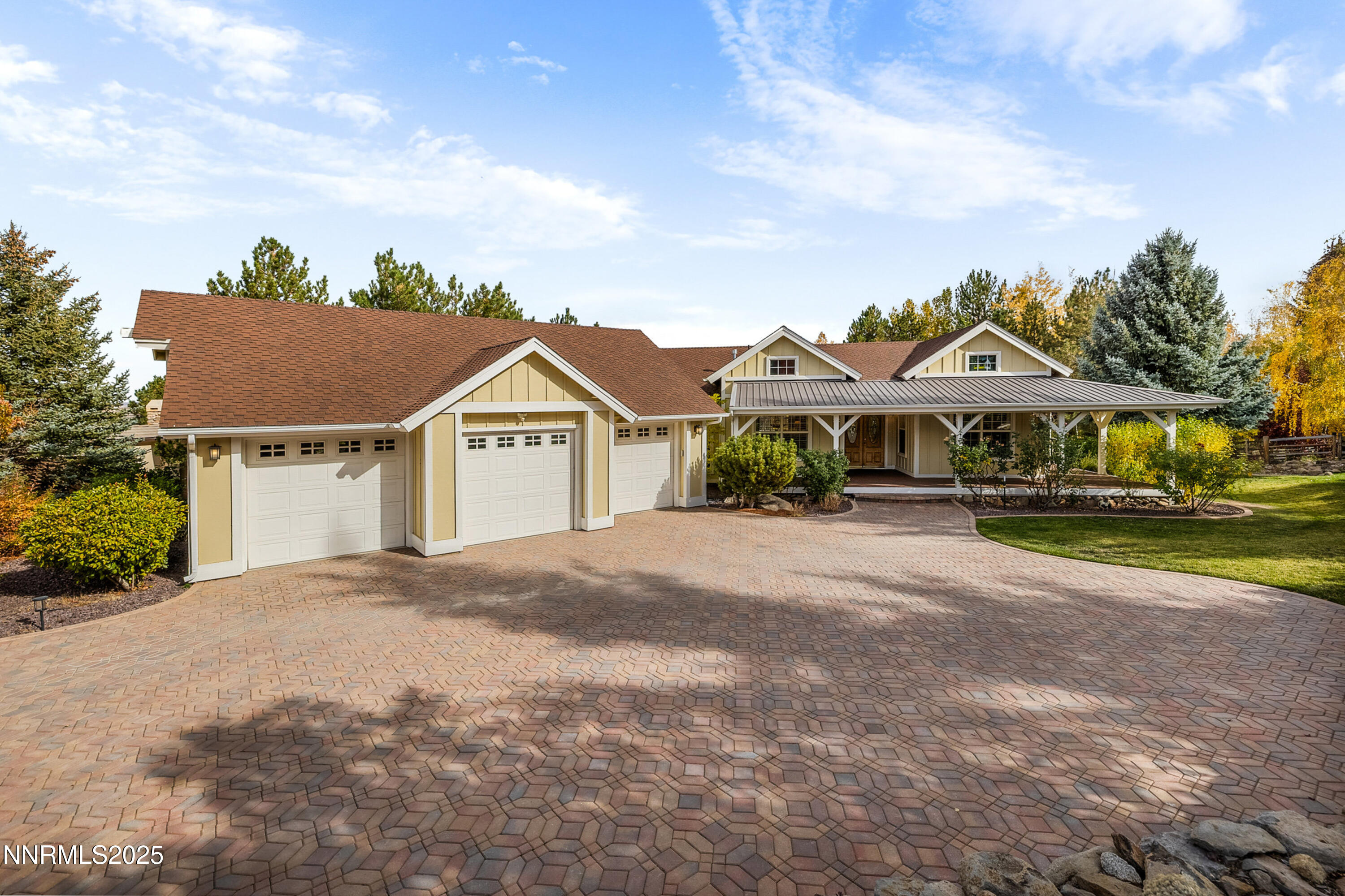 14240 Bandolier Court Reno, NV 89511 - Photo 40 of 47 a front view of a house with a yard and garage