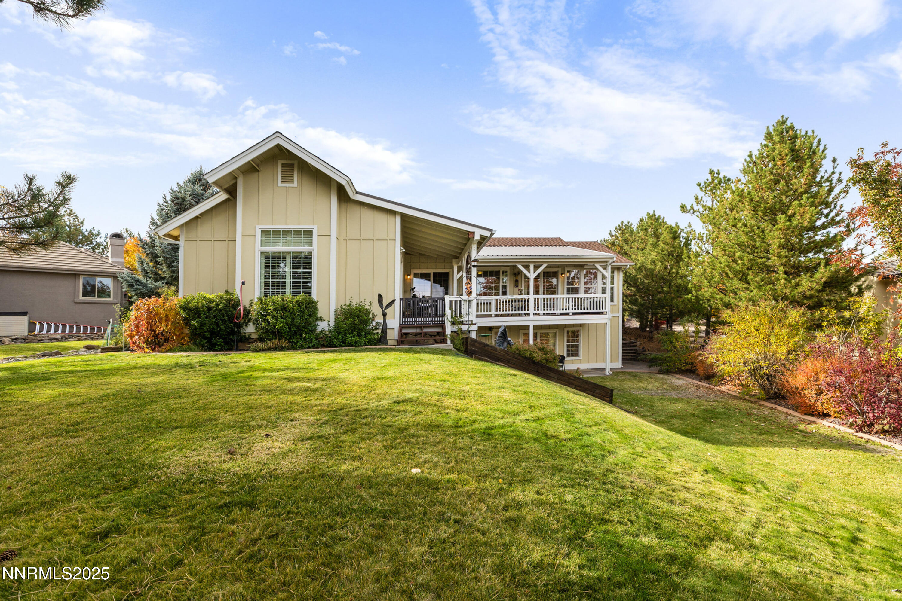 14240 Bandolier Court Reno, NV 89511 - Photo 5 of 47 a front view of a house with garden