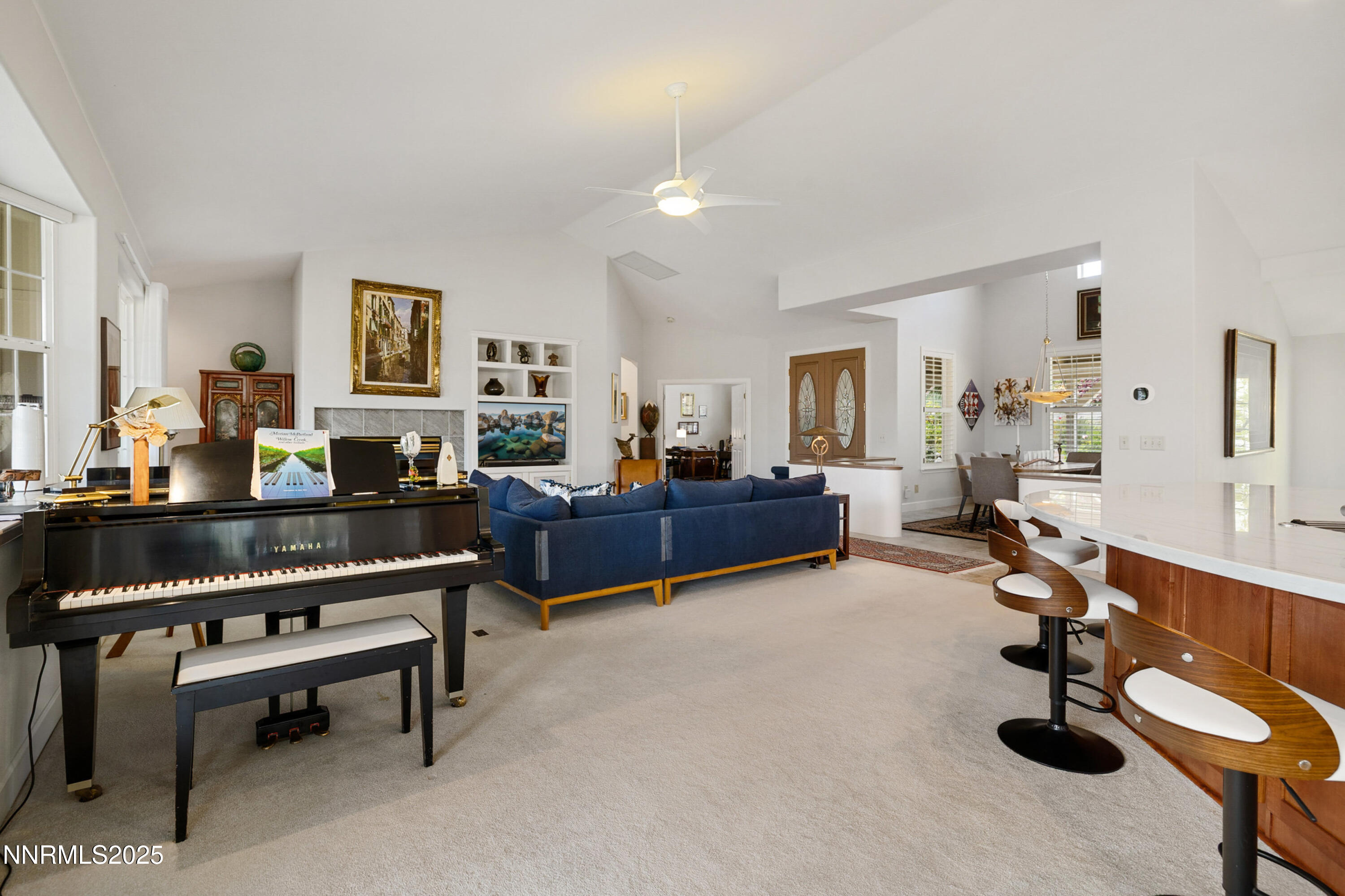 14240 Bandolier Court Reno, NV 89511 - Photo 8 of 47 a living room with furniture and a dining table with wooden floor