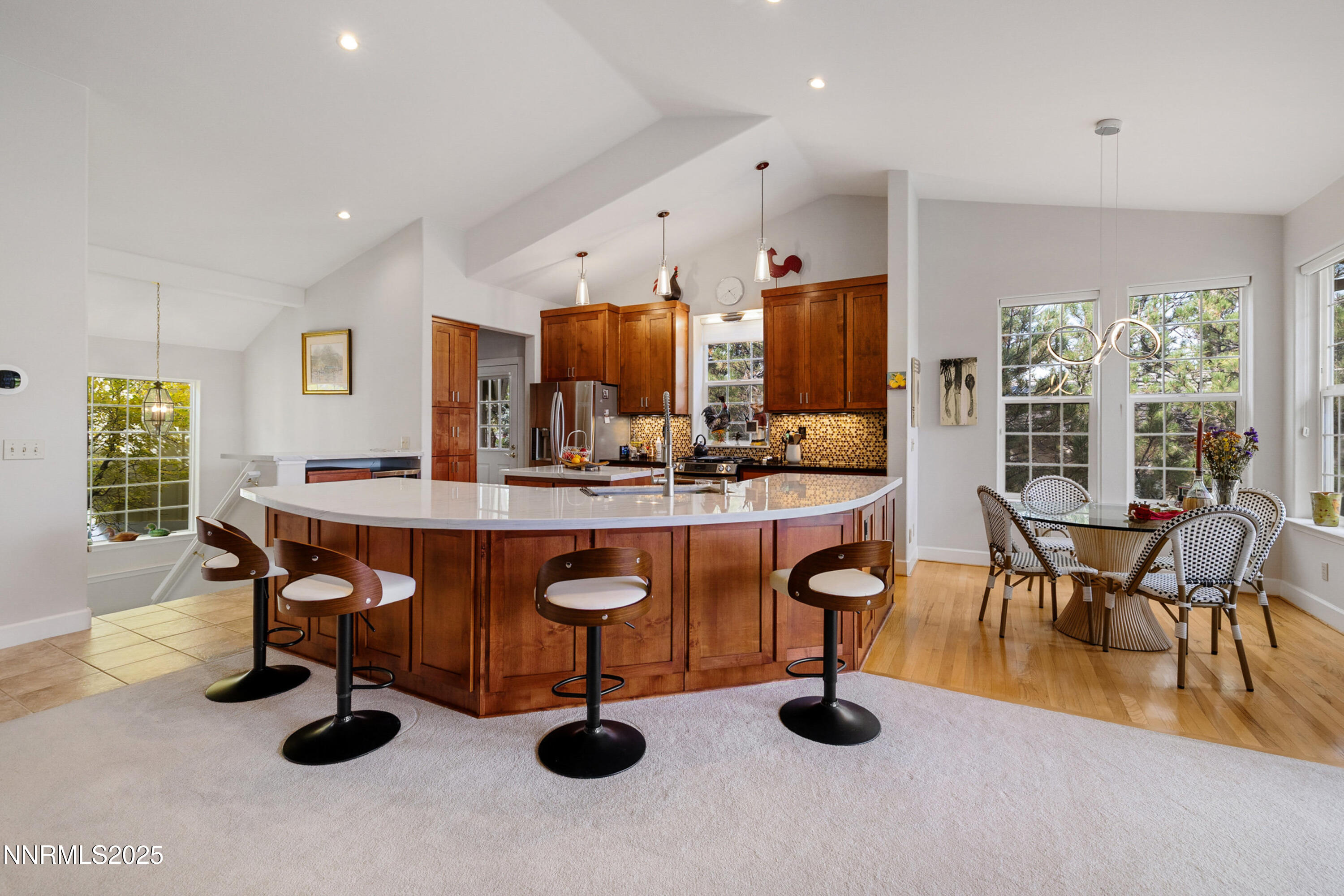 14240 Bandolier Court Reno, NV 89511 - Photo 10 of 47 a dining room with furniture and a chandelier