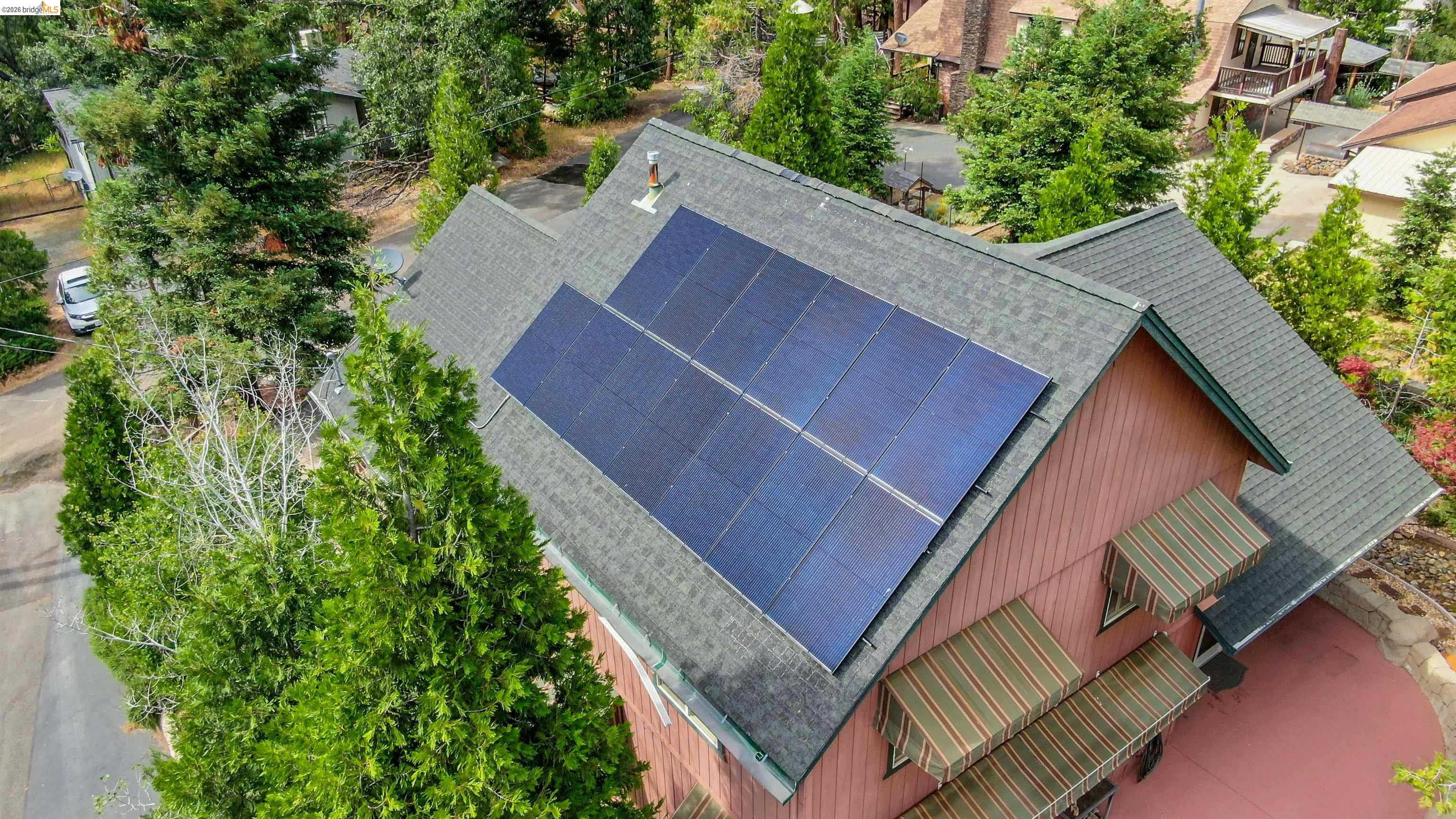 22401 Ridge Road Twain Harte, CA 95383 - Photo 48 of 56 Asphalt shingle roof with integrated solar panels